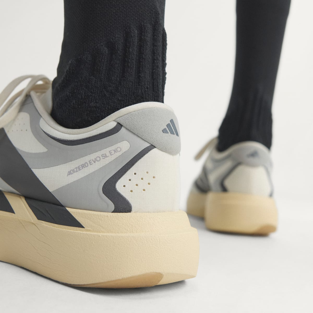 Adidas Men's ADIZERO EVO SL EXO Shoes - Core White / Utility Black / Grey Two - Image 10