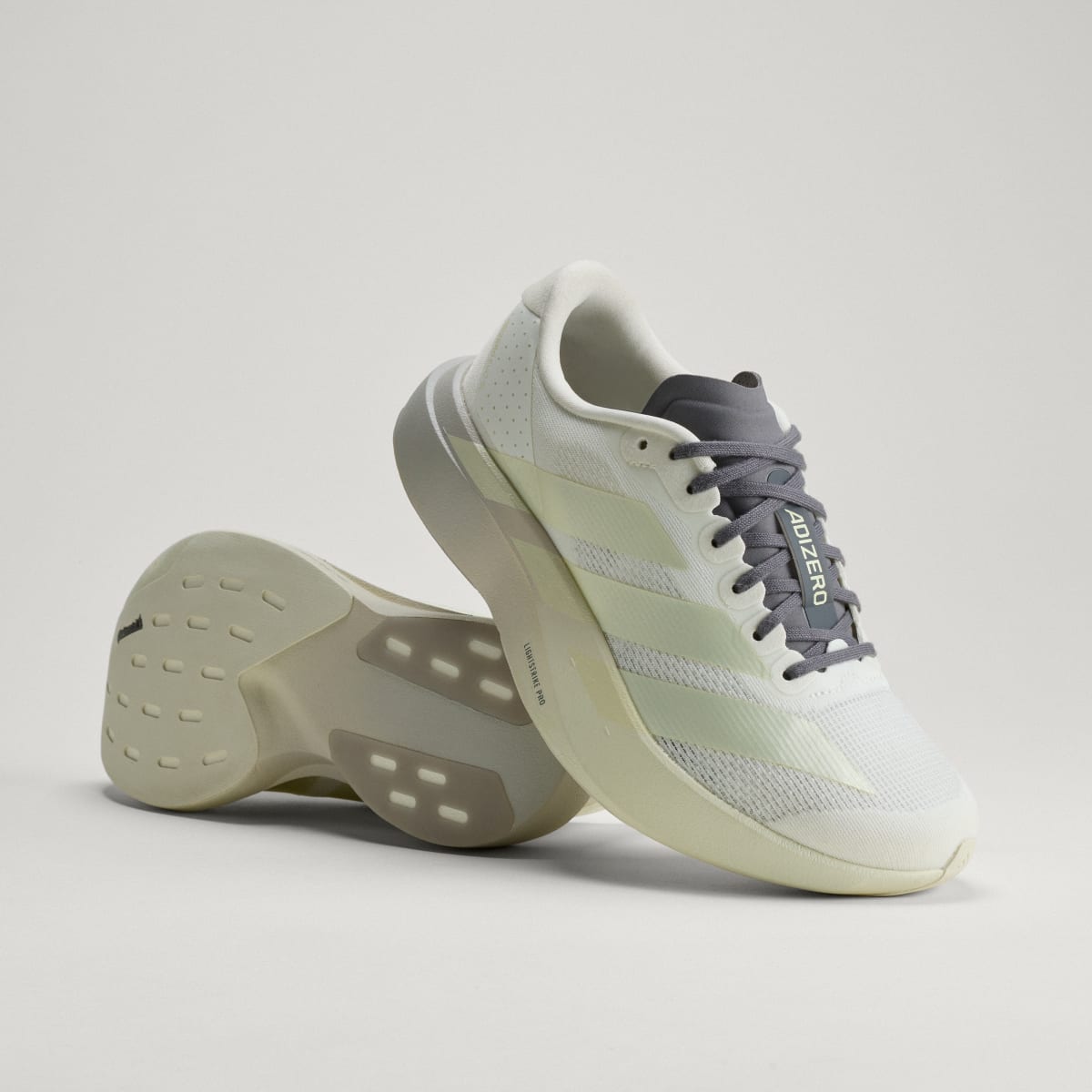 Adidas Women's Adizero EVO SL Shoes - Off White / Ice Gold Met. / Granite - Image 1