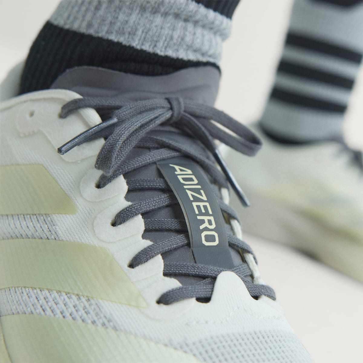 Adidas Women's Adizero EVO SL Shoes - Off White / Ice Gold Met. / Granite - Image 6
